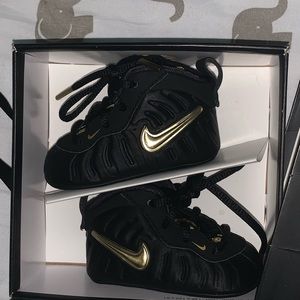 Baby black and gold Nike foamposite